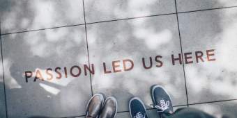 passion led us here written on a sidewalk set in front of two pairs of feet|5 Smart phones displaying the Hopelab protogype|Bladder app prototype screenshots with purple buttons for the user to enter data